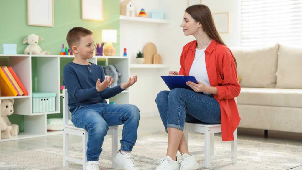 M-Chat screening tool Clinician talks with child during autism screening for toddlers