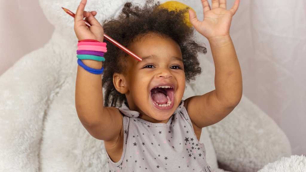 Toddler showing excitement, social communication and responding to name milestone