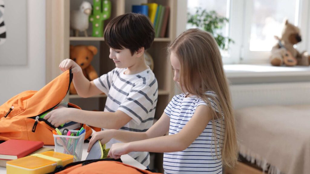 Children organizing school supplies as part of a daily routine