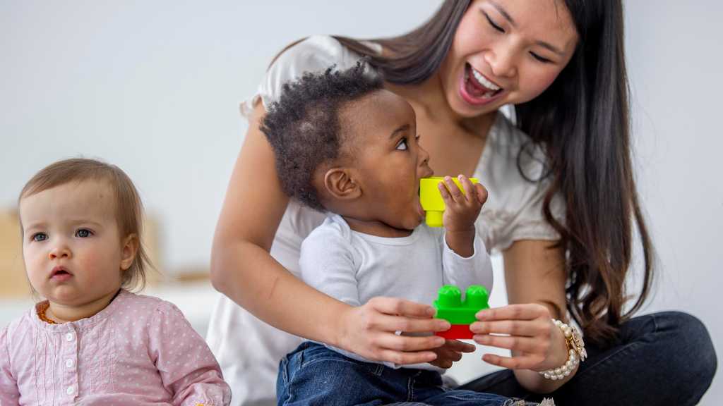 Parent engaging toddler with toys, toddler not responding to name during play